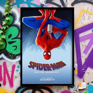 May include: A framed movie poster for "Spider-Man: Into the Spider-Verse." The poster features Spider-Man upside down, holding a mug. The title is in a stylized font, with the release date, December 14, at the bottom.