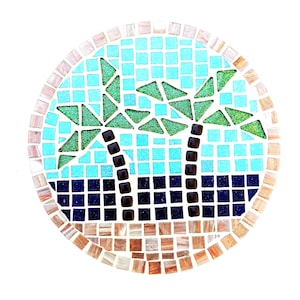May include: Circular mosaic artwork depicting a tropical scene. It features two palm trees with green triangular leaves and dark brown trunks, set against a turquoise and blue background. The border is made of small, multi-coloured tiles.