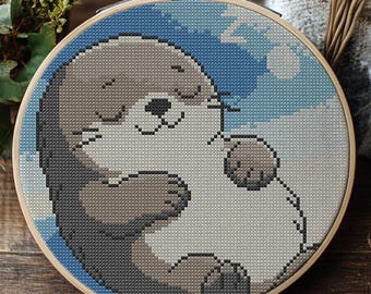 Lontra sonolenta. Desenho fácil para ponto cruz