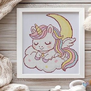 Schlafendes Einhorn auf dem Mond. Fantasy Design für Kreuzstich