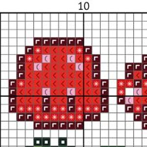 May include: A cross-stitch pattern featuring two red mushrooms with white and pink accents. The mushrooms are set against a grid background, with a green stem visible below the left mushroom. The pattern is designed for needlecraft.