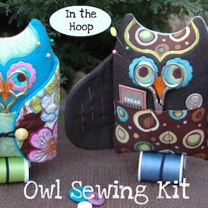 May include: Two owl-shaped sewing kits. One is turquoise with floral fabric, the other is dark brown with circular patterns. Both have scissors, pockets, and the text "In the Hoop" and "Owl Sewing Kit".