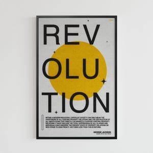May include: A framed poster with the word "REVOLUTION" in large black letters, with a yellow circle in the center. The poster includes text at the bottom, with the author's name, George Jackson.