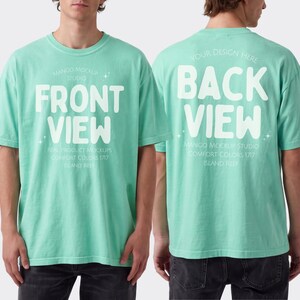 May include: A mint green short-sleeve t-shirt featuring white text. The front displays the words FRONT VIEW with smaller text below, while the back displays the words BACK VIEW with smaller text below. The shirt has a crew neckline.
