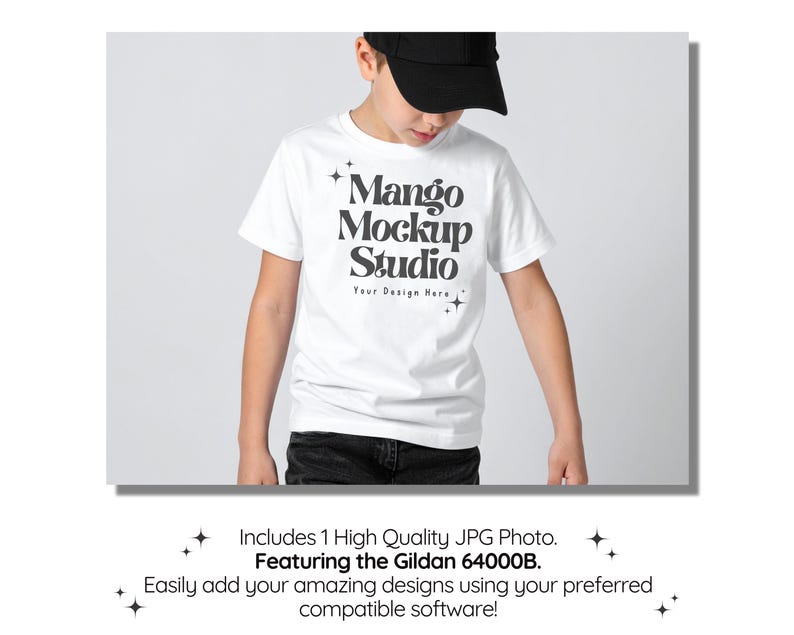 May include: A white t-shirt with the text "Mango Mockup Studio" in a black, bold font. The shirt is worn by a person wearing a black baseball cap and dark jeans. The image is a mockup for design software.
