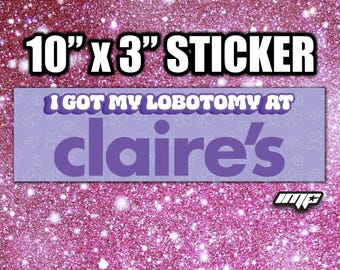 May include: A rectangular 10 inch by 3 inch sticker with a light purple background featuring a subtle white floral pattern. The text reads I GOT MY LOBOTOMY AT claire's in bold purple and white lettering. A small white logo is in the bottom right corner.