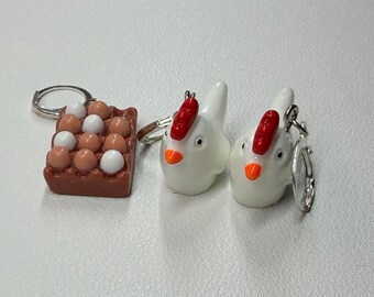 Ensemble de trois marqueurs de points : poules et œufs