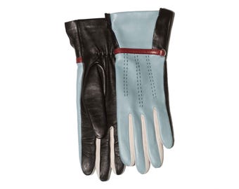 May include: A pair of leather gloves with a blue and white color scheme. One glove is black with a white cuff and the other is blue with a white cuff and a red strap.