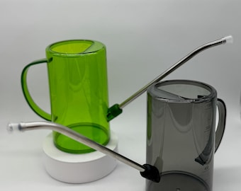 May include: Two cylindrical watering cans with long, thin metal spouts and clear plastic bodies. One can is bright green, and the other is translucent gray with black measurement markings printed on the side, indicating up to 1000 milliliters.