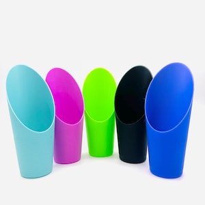 May include: A collection of five colorful scoops in shades of teal, magenta, green, black, and blue. Each scoop has a curved top and a ridged texture on the lower portion, set against a white background.