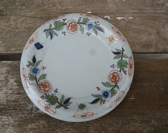 Petit plat en faience XIX siecle motif fleurs naives