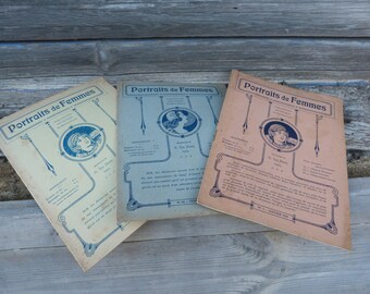 May include: Three vintage magazine covers with the title "Portraits de Femmes" in blue lettering on a tan background. Each cover features a black and white illustration of a woman in a circle with a decorative border. The covers are arranged in a row on a wooden surface.