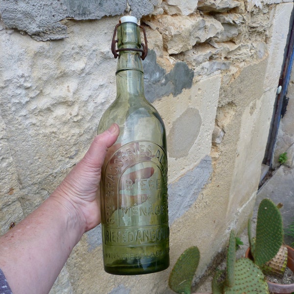 Bouteille de biere 1900 en verre brasserie bouchon porcelaine