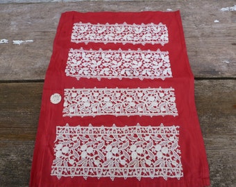 Vintage old French 1900 lace trims samples on red fabric coming from haberdashery's attic