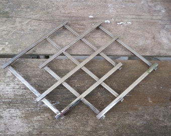 Jacques ADNET  stretchy  silver metal Art Deco mid century 1940 1950  old vintage silverplate table  trivet