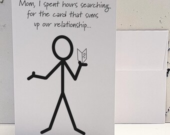 May include: A greeting card with a stick figure illustration holding a card that says "Happy Mother's Day". The card reads "Mom, I spent hours searching for the card that sums up our relationship..."