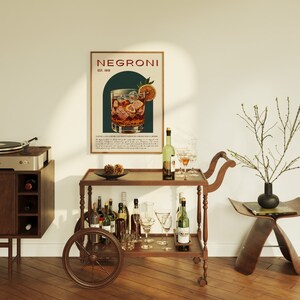 Mid-century bar with vintage decor and featuring a poster; a classic Negroni cocktail in a glass with ice and an orange slice, the style is retro. The poster details the drinks history, recipe and ingredients; warm wood tones and elegant styling.