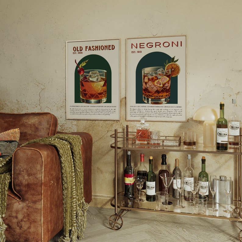 Elegant lounge with leather sofa, bar cart, and framed posters; a classic Negroni cocktail in a glass with ice and an orange slice and a classic Old Fashioned cocktail, garnished with an orange twist and cherry; featuring a chic, lived-in aesthetic