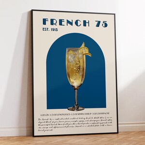 May include: A vintage-style poster with a blue and beige color scheme. The poster features a glass of champagne with a lemon twist and the text "FRENCH 75 EST. 1915". The poster also includes a recipe for the cocktail, which includes gin, lemon juice, simple syrup, and champagne.