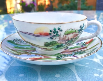 Japanese Fine Eggshell Porcelain Teacup & Saucer Duo. Landscape in Hand Painted Colourful Enamels, Gilt Rims. Oriental Theme Afternoon Tea