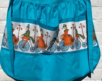 Vintage Prova  Half Apron with Pockets - Turquoise Blue with Penny Farthing Cyclists Printed Pattern - BHS 1960s