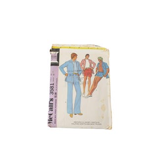 May include: A vintage McCall's 3581 sewing pattern envelope featuring illustrations of a patio jacket, pants, walking shorts, and swim trunks. The white paper envelope displays the text McCall's 3581, chest 42, waist 36, and no refunds or returns.