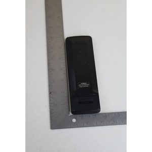 May include: Black remote control with the text "VIZIO PART NO. RC30200000 Made in Singapore" on the back.
