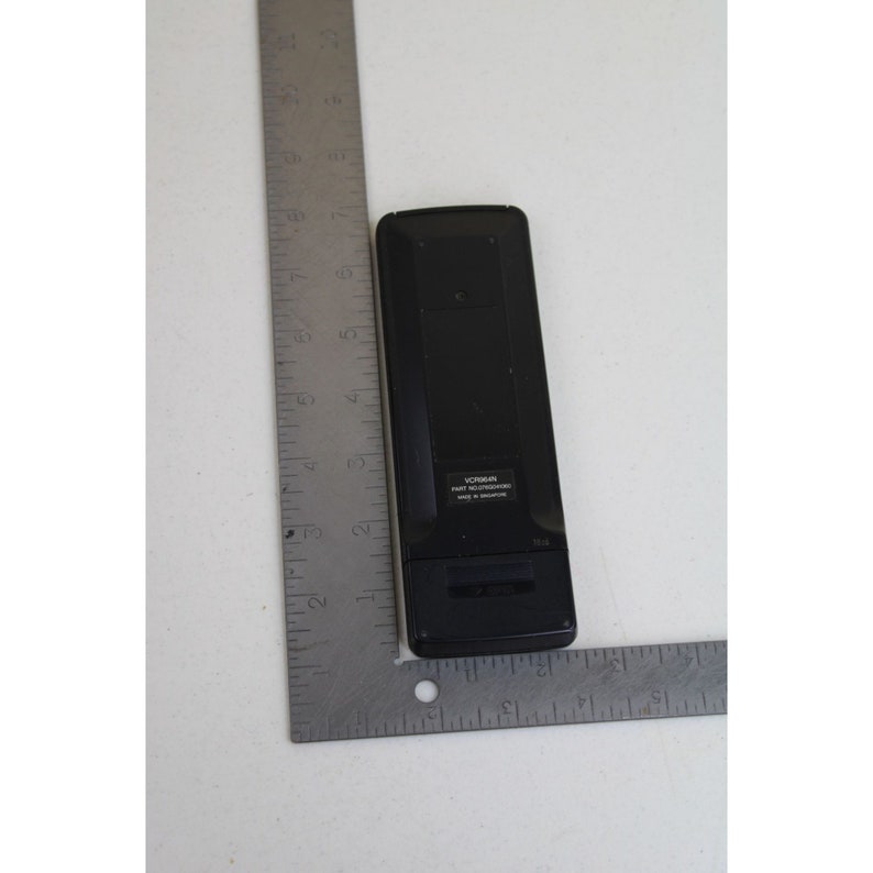May include: Black remote control with the text "VIZIO PART NO. RC30200000 Made in Singapore" on the back.