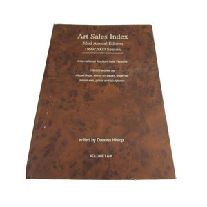 May include: A brown book titled "Art Sales Index" with the text "32nd Annual Edition 1999/2000 Season" and "International Auction Sale Results". The book also includes the text "138,000 entries for oil paintings, works on paper, drawings, miniatures, prints and sculptures" and "edited by Duncan Hislop" and "VOLUME I A-K".