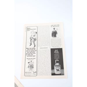 May include: A vintage magazine page featuring advertisements and illustrations. One ad shows a couple, with text that reads "Make that blonde hop on your lap." Another ad displays a bottle of "York Town" cologne. The page is aged with a white background.