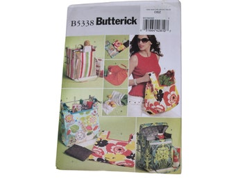 May include: A sewing pattern for making different types of bags, including a tote bag, a shopping bag, and a cooler bag. The pattern is from Butterick and has the number B5338 on it.