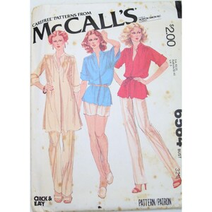 May include: A vintage McCall's sewing pattern for a women's blouse and trousers. The pattern is for a 32 inch bust and is labelled "Quick & Easy". The pattern cover features three women wearing different versions of the pattern.