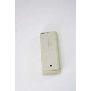 May include: A white remote control with the text "AUTOMATIC LIGHT" and "ON/OFF" printed on it.