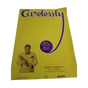 May include: A yellow sheet music cover with a purple and white design. The title of the song is "Carelessly". The sheet music is for the song "Carelessly" by Charles and Nick Kenny, music by Norman Ellis. The cover features a photo of Louis Panico holding a trumpet. The sheet music is published by Irving Berlin Inc. Music Publishers, 799 Seventh Ave. New York, NY.