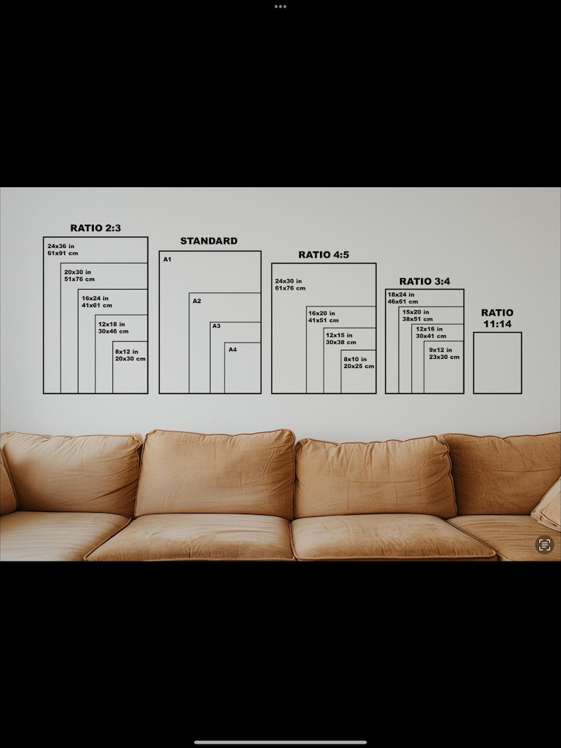 May include: A chart showing different aspect ratios for prints, including 2:3, 4:5, 3:4, and 11:14. The chart includes measurements in inches and centimeters for each ratio. The chart is displayed on a wall behind a brown couch.