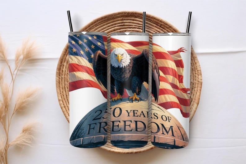 May include: Three white stainless steel tumblers with black straws, each featuring a patriotic design. The design includes an American flag, a bald eagle, and the text "250 YEARS OF FREEDOM."