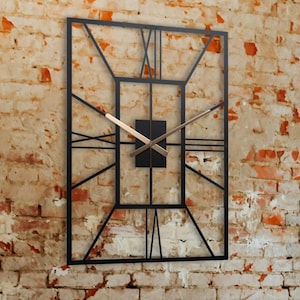 May include: A black metal clock with Roman numerals hangs on a brick wall above a wooden table with chairs. The table has a black metal base and the chairs have wooden seats and backs.