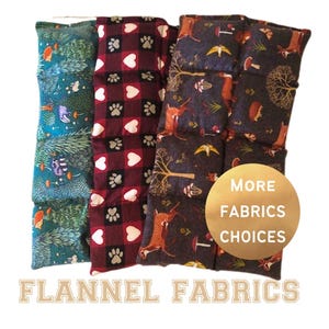 May include: Four rectangular flannel fabric items with various patterns. One has a forest scene with animals, another has hearts and paw prints, and the others have foxes and mushrooms. The text "MORE FABRICS CHOICES" is on a gold circle. The text "FLANNEL FABRICS" is at the bottom.