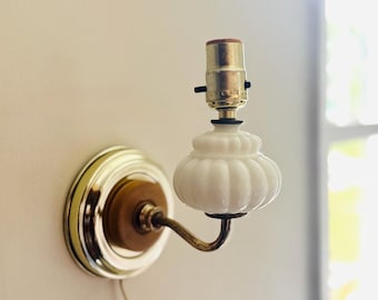 Vintage brass and milk glass wall mount sconce