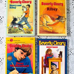 May include: Four paperback books by Beverly Cleary titled Henry and Ribsy, Ribsy, Dear Mr. Henshaw, and Muggie Maggie. Each cover features colorful illustrations of children and dogs, with the author's name and book titles printed in bold text.