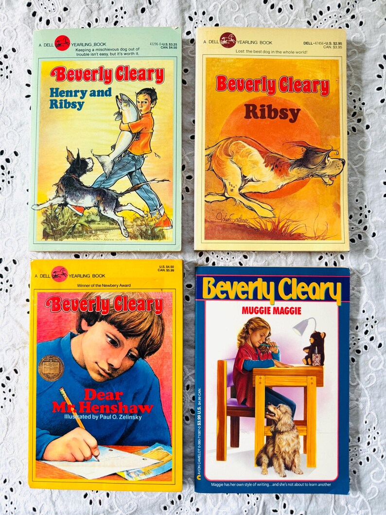 May include: Four paperback books by Beverly Cleary titled Henry and Ribsy, Ribsy, Dear Mr. Henshaw, and Muggie Maggie. Each cover features colorful illustrations of children and dogs, with the author's name and book titles printed in bold text.