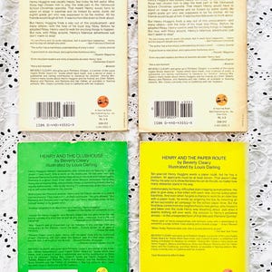 May include: Four paperback books by Beverly Cleary, including two copies of Henry Huggins with tan covers, one green Henry and the Clubhouse, and one yellow Henry and the Paper Route, all featuring back cover synopses, barcodes, and ISBN numbers.