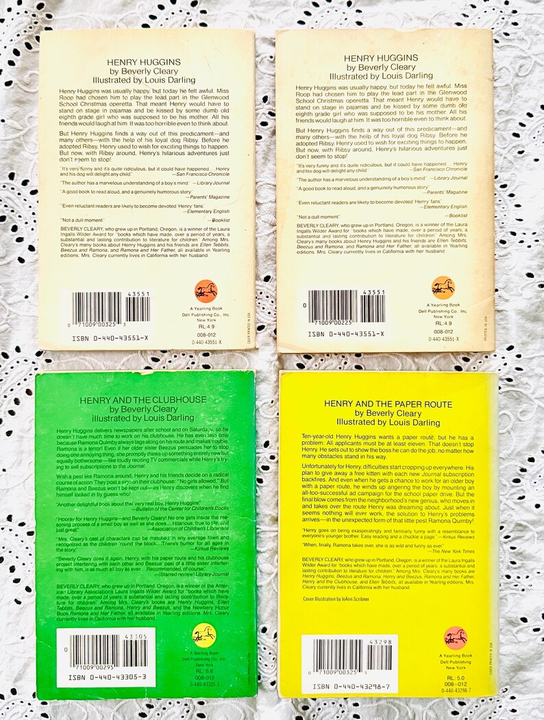 May include: Four paperback books by Beverly Cleary, including two copies of Henry Huggins with tan covers, one green Henry and the Clubhouse, and one yellow Henry and the Paper Route, all featuring back cover synopses, barcodes, and ISBN numbers.