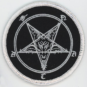 May include: Black and white embroidered patch with a pentagram and a goat's head inside. The pentagram is surrounded by a circle with the letters 'S.P.D.M.A.T.' around it.
