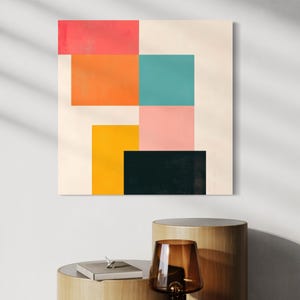 Puede incluir: Impresi&oacute;n de arte geom&eacute;trico abstracto con un dise&ntilde;o colorido que presenta cuadrados en tonos de rosa, naranja, amarillo, turquesa y negro sobre un fondo crema.