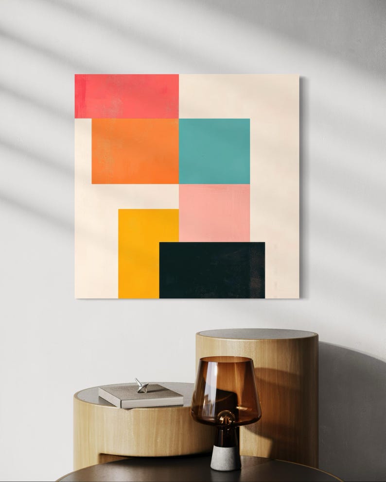 Puede incluir: Impresi&oacute;n de arte geom&eacute;trico abstracto con un dise&ntilde;o colorido que presenta cuadrados en tonos de rosa, naranja, amarillo, turquesa y negro sobre un fondo crema.