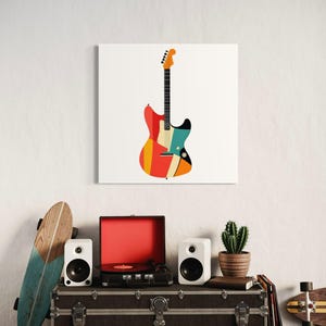 Może przedstawiać: Kolorowy nadruk gitary elektrycznej w stylu retro na białym tle. Gitara ma żywy design z czerwonymi, pomarańczowymi, ż&oacute;łtymi i niebieskimi paskami. Obraz jest częścią dekoracji o tematyce muzycznej.