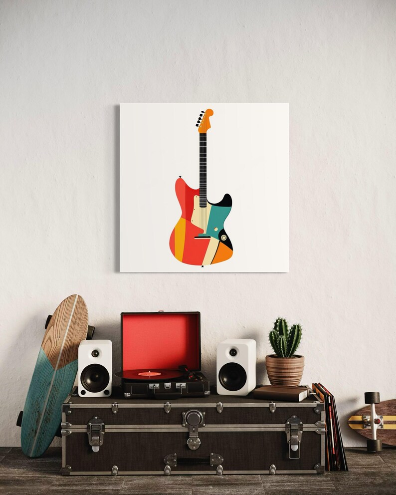 Może przedstawiać: Kolorowy nadruk gitary elektrycznej w stylu retro na białym tle. Gitara ma żywy design z czerwonymi, pomarańczowymi, ż&oacute;łtymi i niebieskimi paskami. Obraz jest częścią dekoracji o tematyce muzycznej.