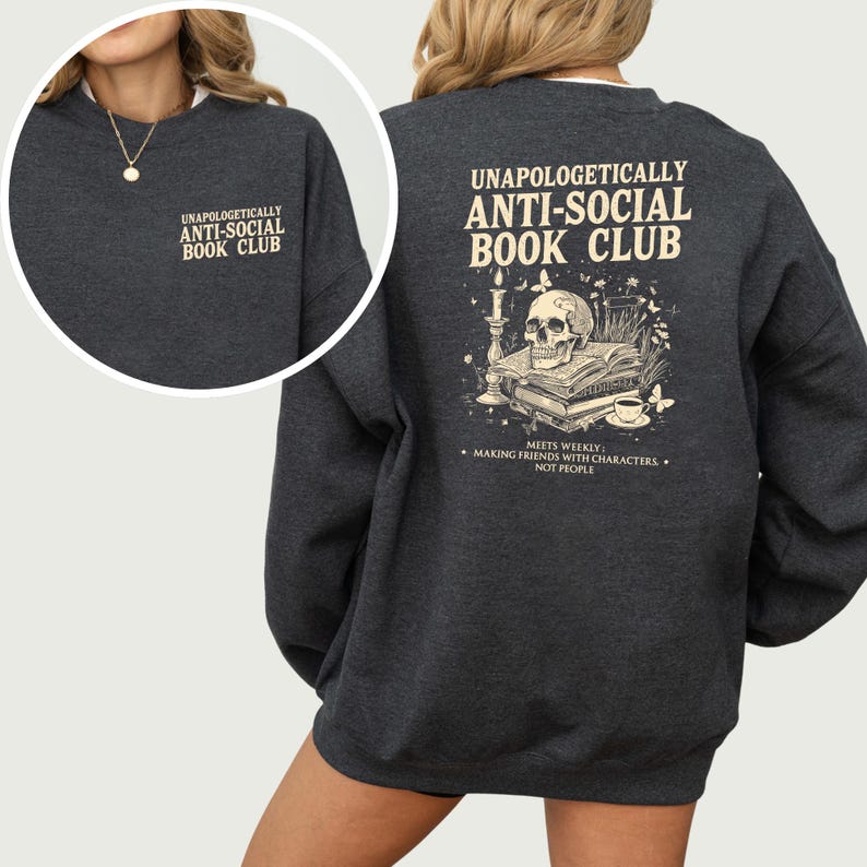 a gray sweatshirt with text and an illustration on the back.