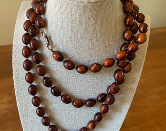 Long strand plastic tortoiseshell pattern beaded necklace, likely 1980s in excellent condition